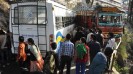 Road blocked after a speeding truck hit a crowed bus today