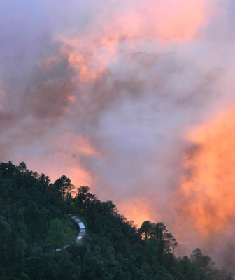 A toy train on its way in colorful misty sunset in Shimla after heavy rain on Saturday evening.Photo by: Amit Kanwar