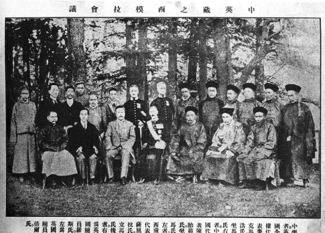 Representatives of Tibet, Great Britain, and China at Simla Accord 1914. Front row, from left: an assistant to Ivan Chen; Sekyong Trulku, Prince of Sikkim; Ivan Chen, Chinese plenipotentiary; Sir Henry McMahon, British Plenipotentiary; Lonchen Shatra, Tibetan Plenipotentiary; Teji Trimon, assistant; Nedon Khanchung, Secretary.